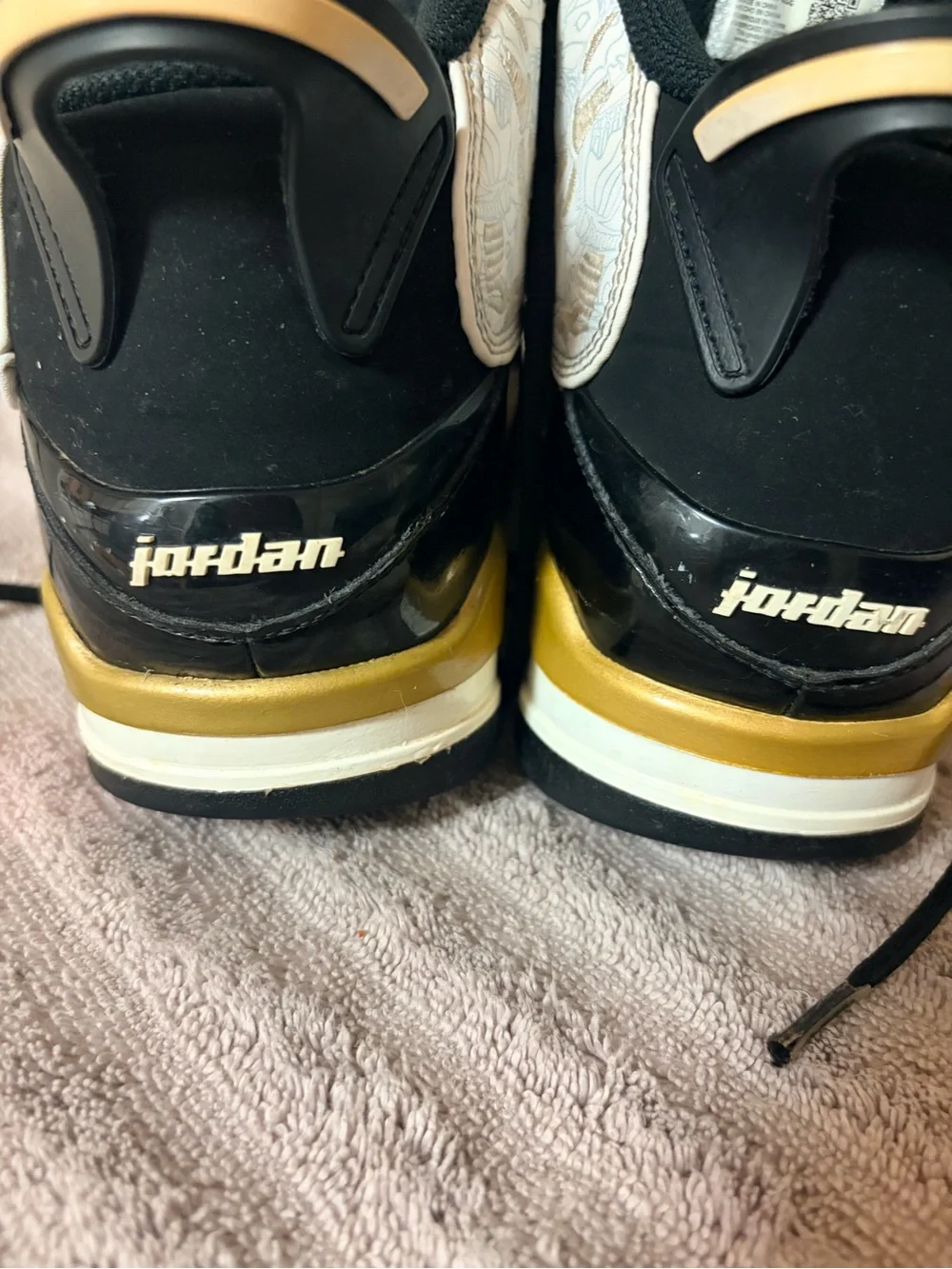 Jordan Mid-Top Sneakers in Black, White & Gold Detailing